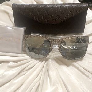 Gucci silver sunglasses frame has embossed gg